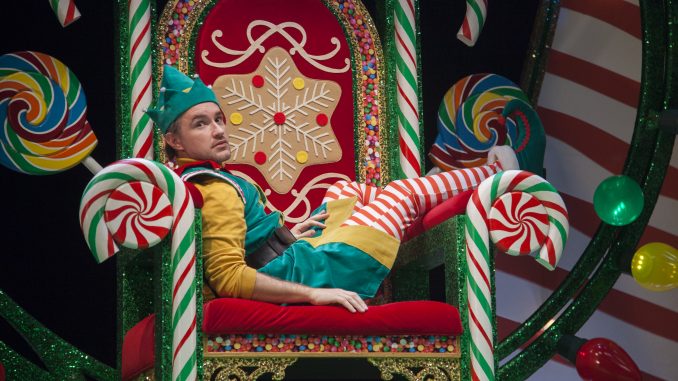 An elf sits on a throne.